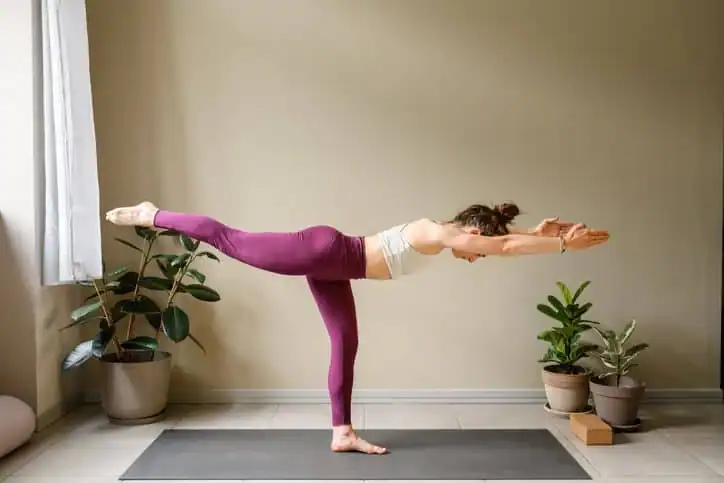 Woman doing Yoga exercise Wickford to help with toning the body. 