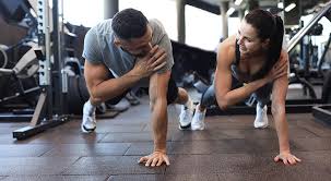 Sculpting Sleek Arms: The Essential Role of Cardio in Toning Without Bulking Up 1 Image of man and woman doing Cardio Wickford to tone their arms.